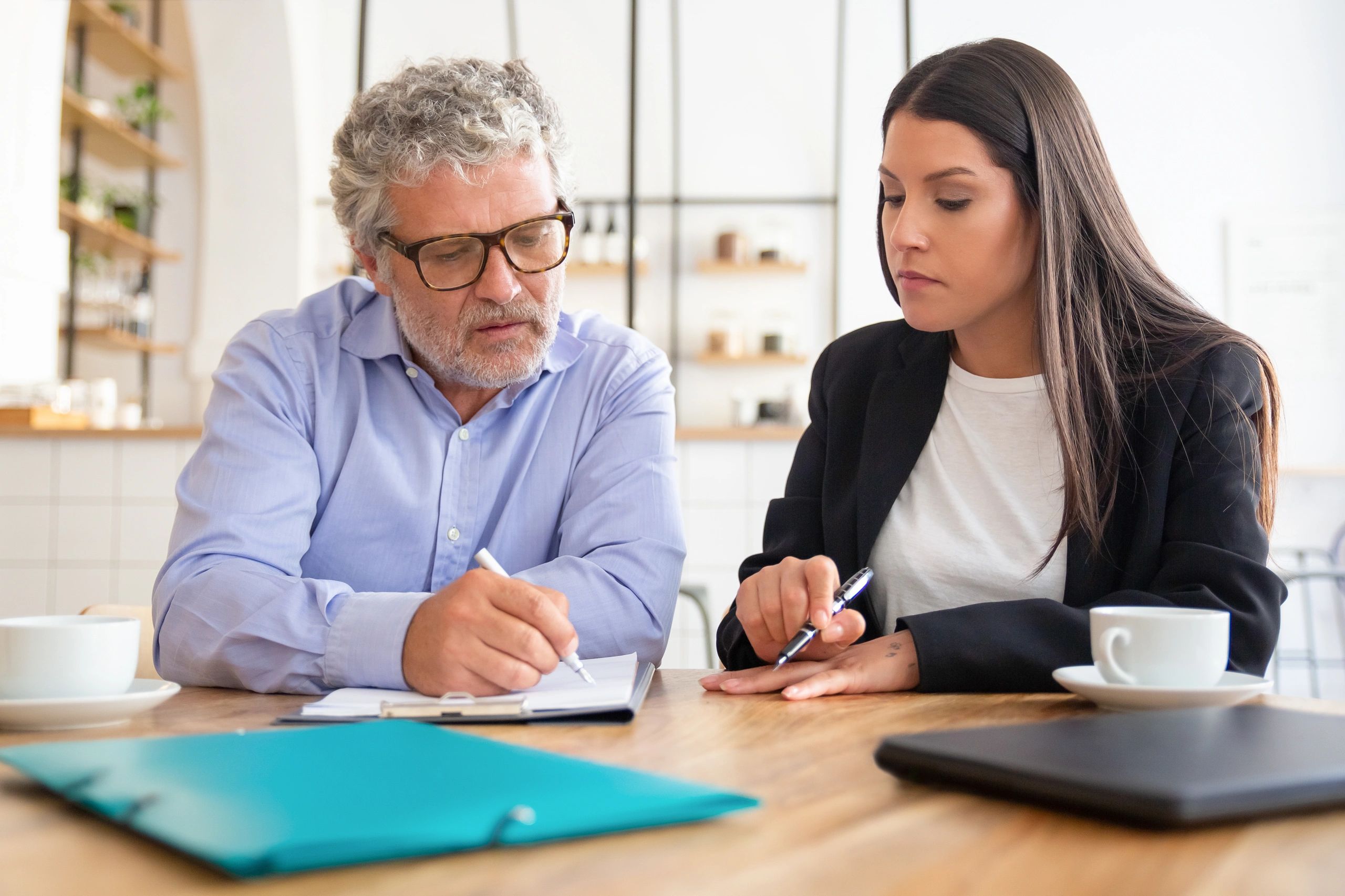 Client reviewing agreement with professional notary support