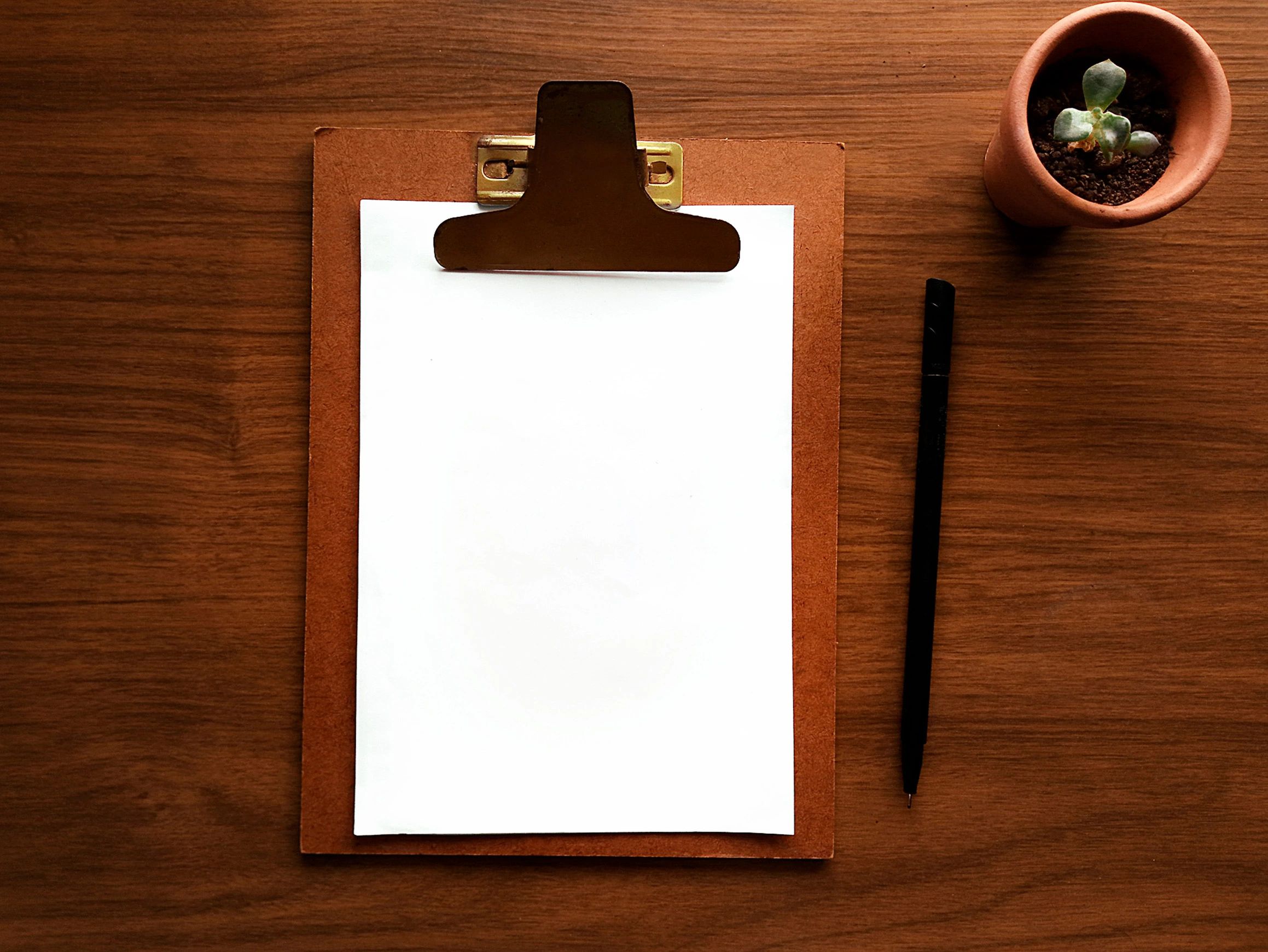 Clipboard and paperwork on a desk representing organized voucher preparation