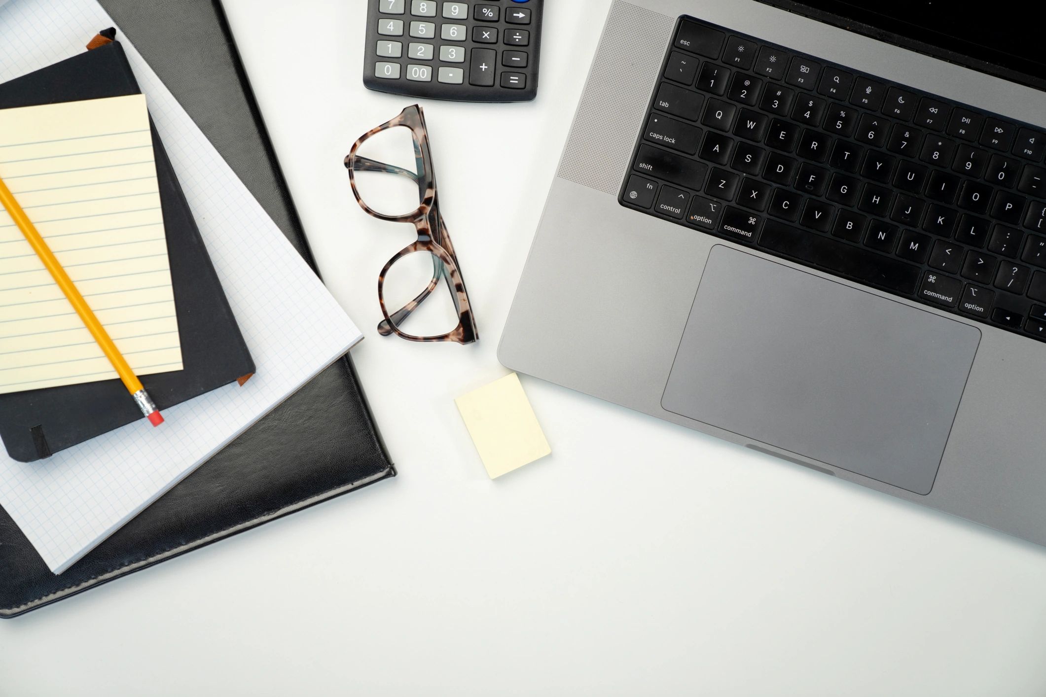 Personal finance tools on a workspace desk
